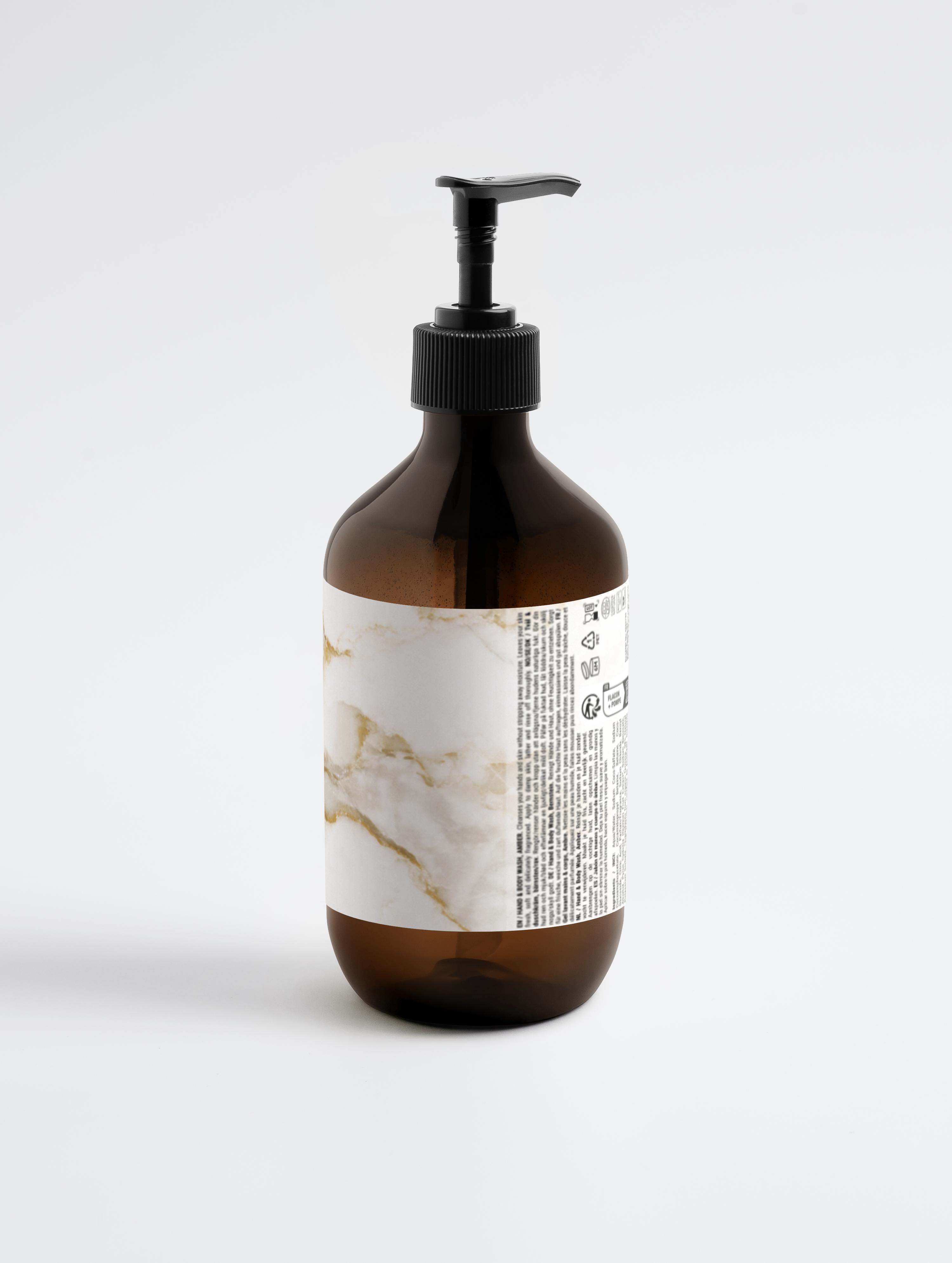 Eclat Soin Hand & Body Wash, Patchouli & Amber Vanilla in a stylish amber bottle with pump dispenser